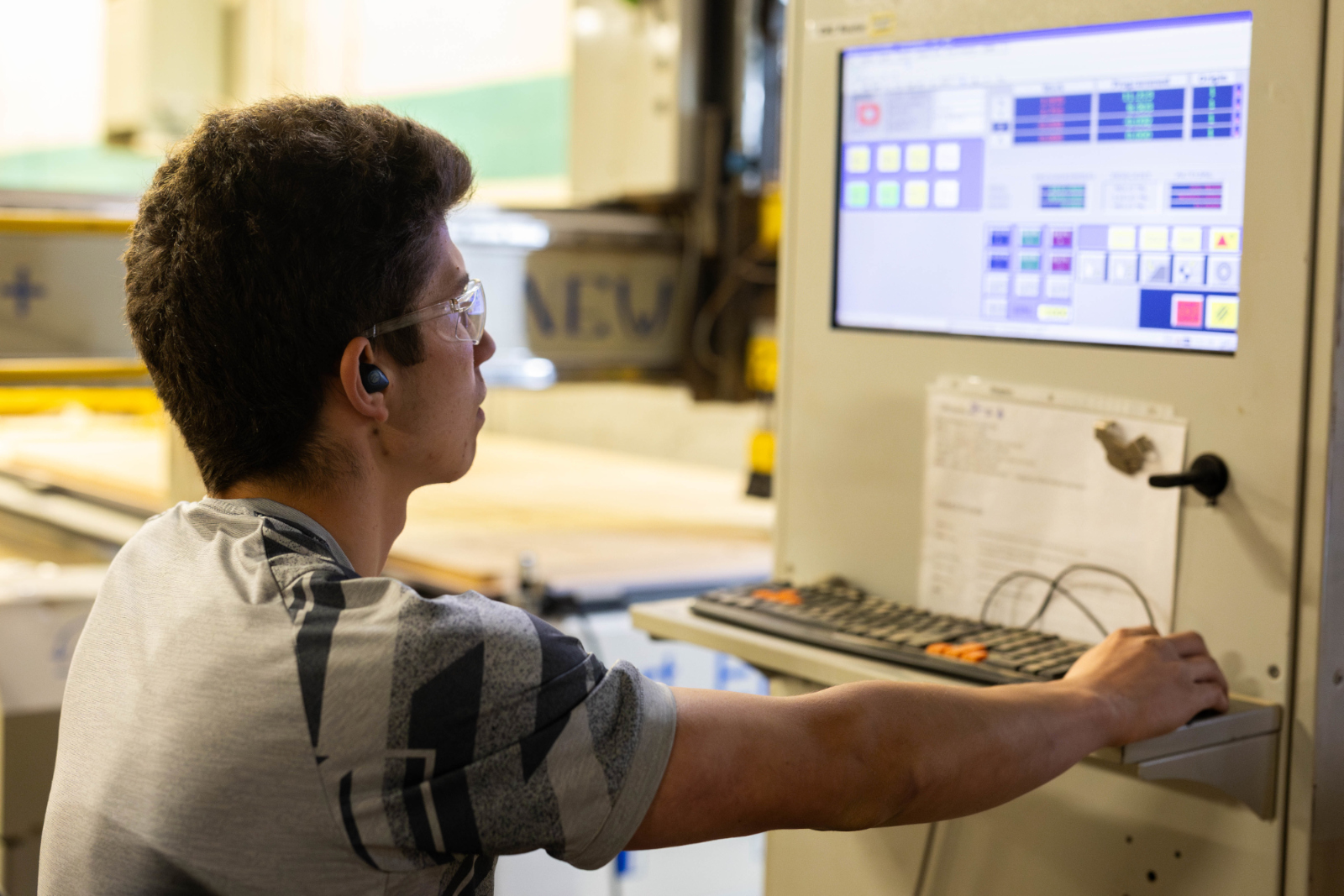 A member works with the CNC machine